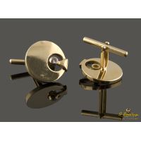 Gemelos redondos realizados en oro amarillo con circonitas.