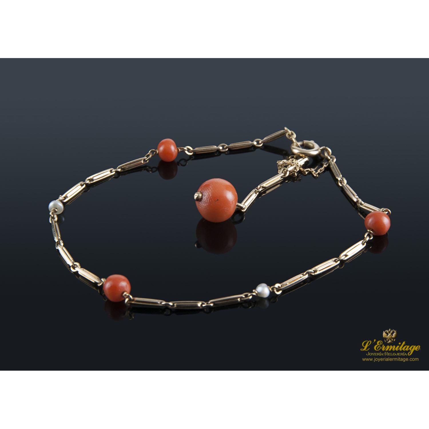 Pulsera oro amarillo y coral