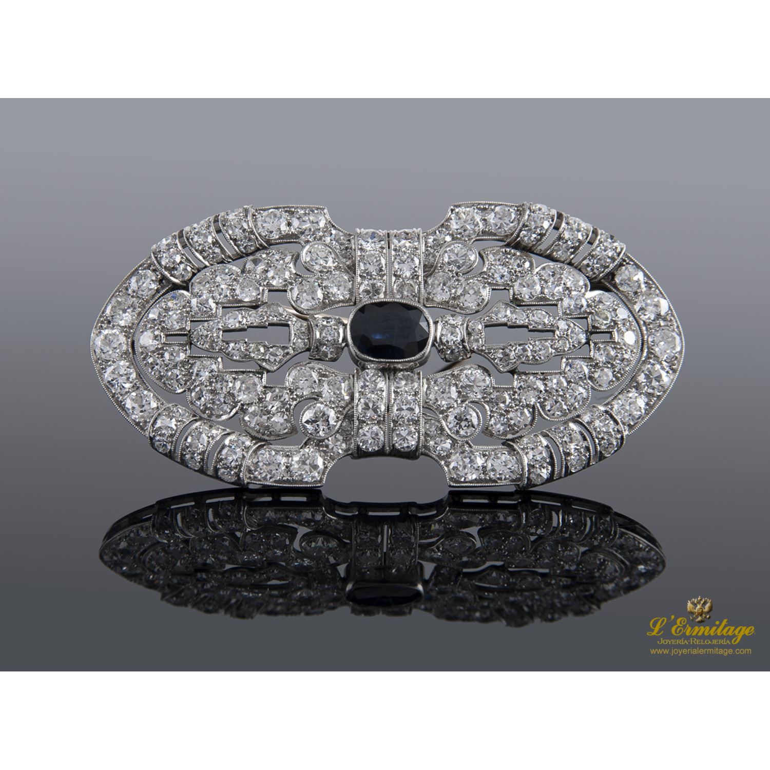 Broche oro blanco y diamantes.