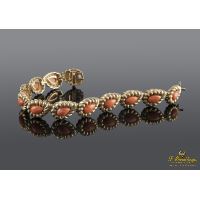 Pulsera realizada en oro amarillo y coral.