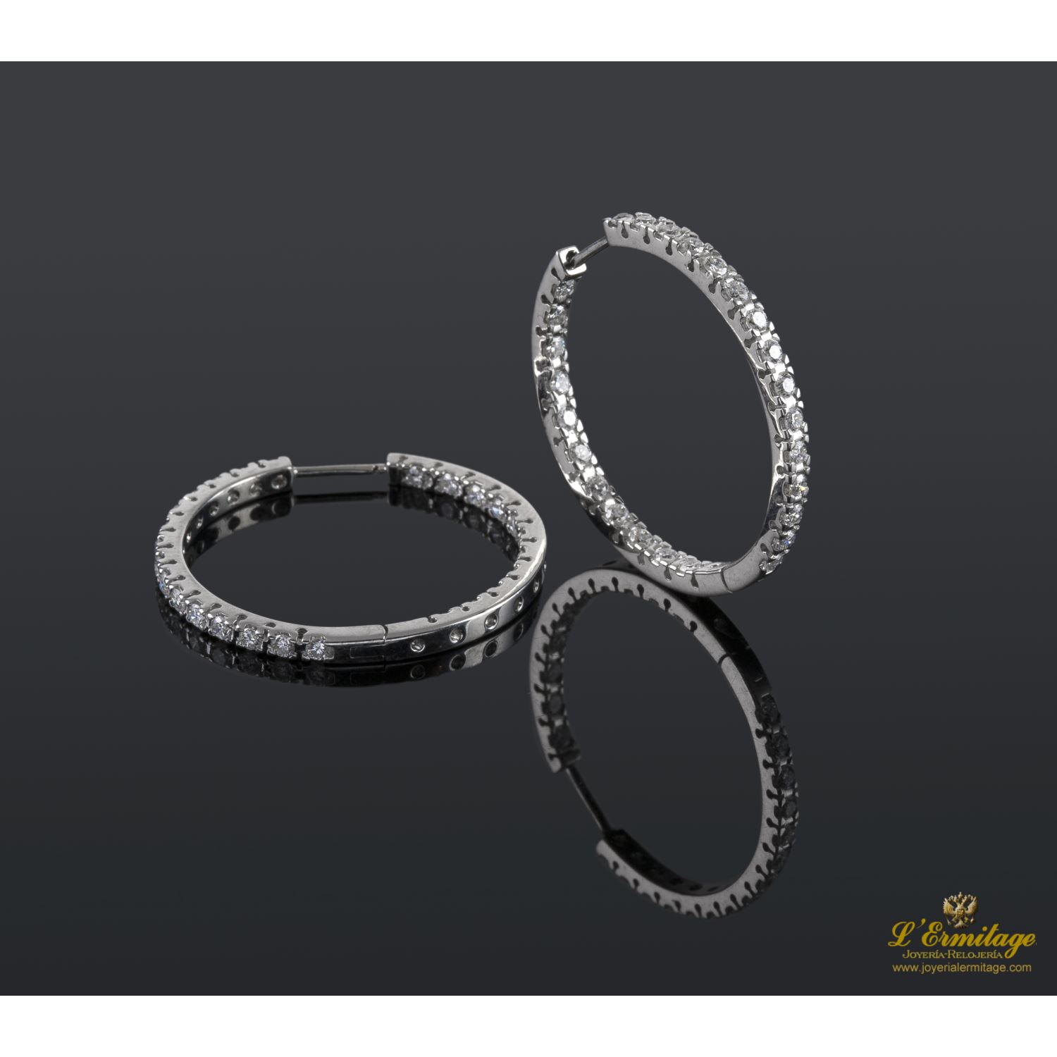 Pendientes criollas oro blanco y diamantes.