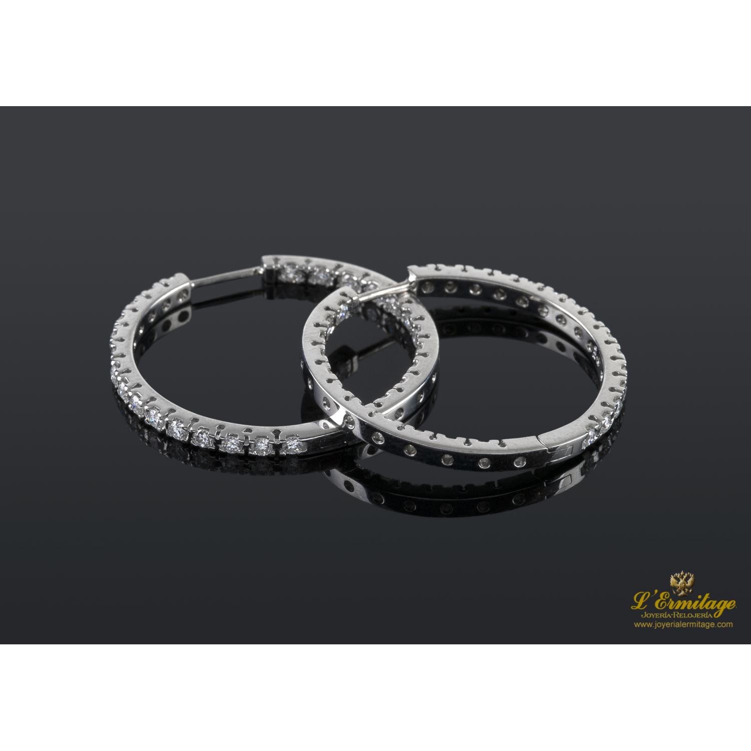 Pendientes criollas oro blanco y diamantes.