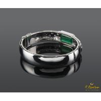 Pulsera rígida en oro blanco con esmeralda y diamantes.