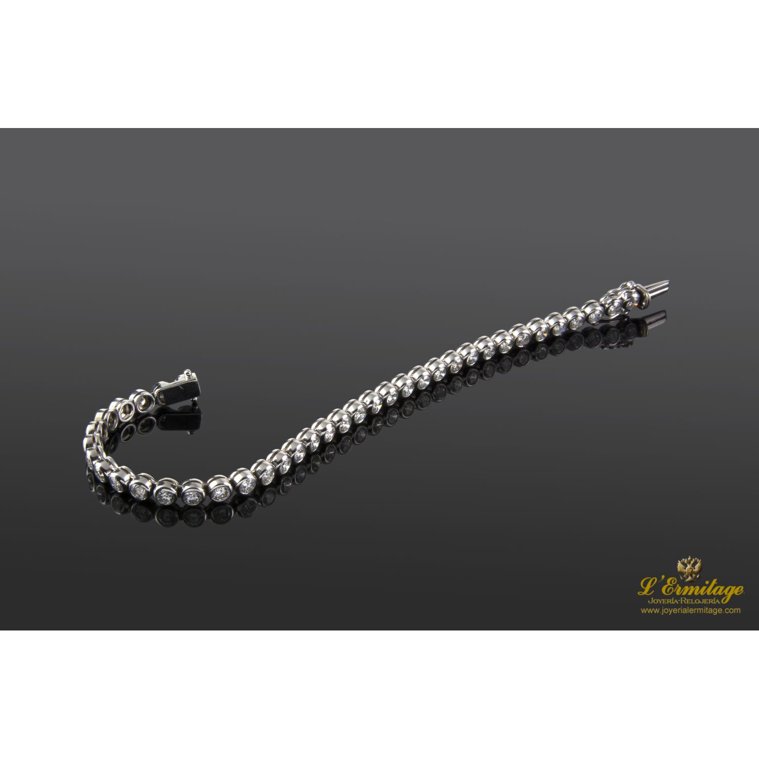 Pulsera oro blanco riviere.