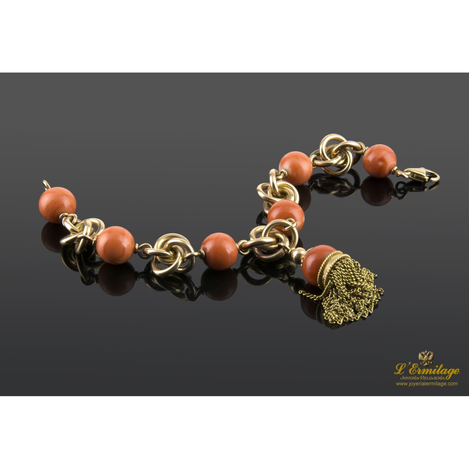 Pulsera en oro amarillo con bolas de coral