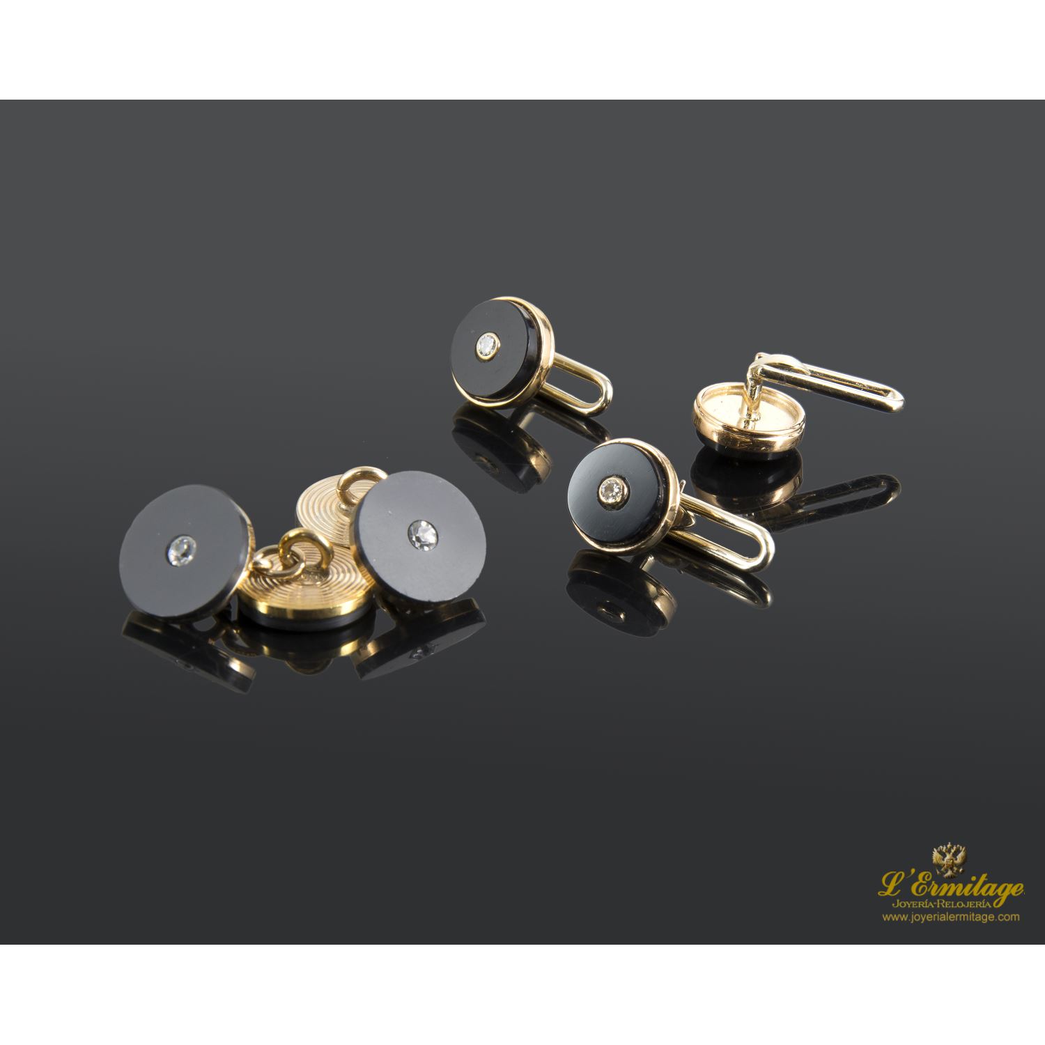 Botonadura oro amarillo ónix y diamantes.
