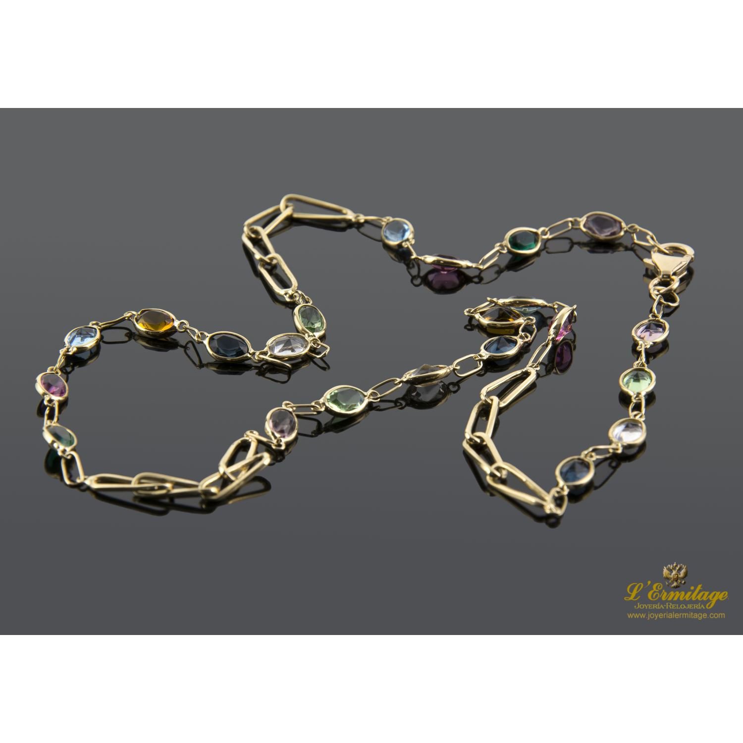 Collar oro amarillo con piedras de color.