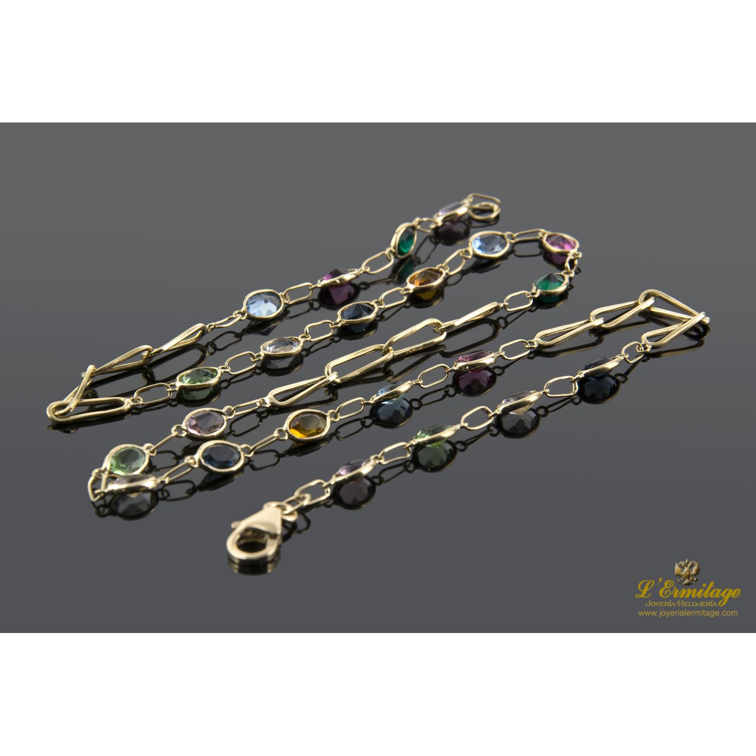 Collar oro amarillo con piedras de color.