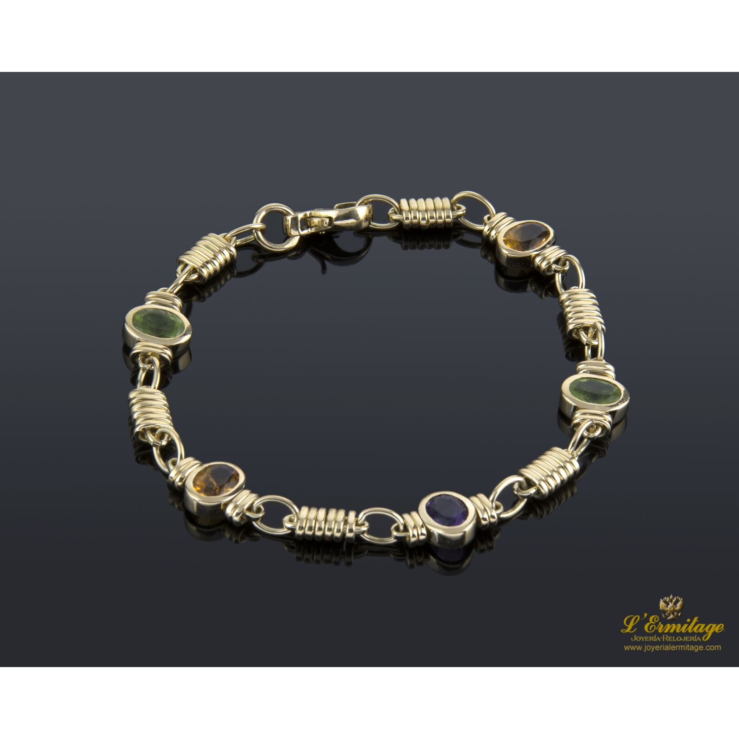 Pulsera oro amarillo y piedras de color.
