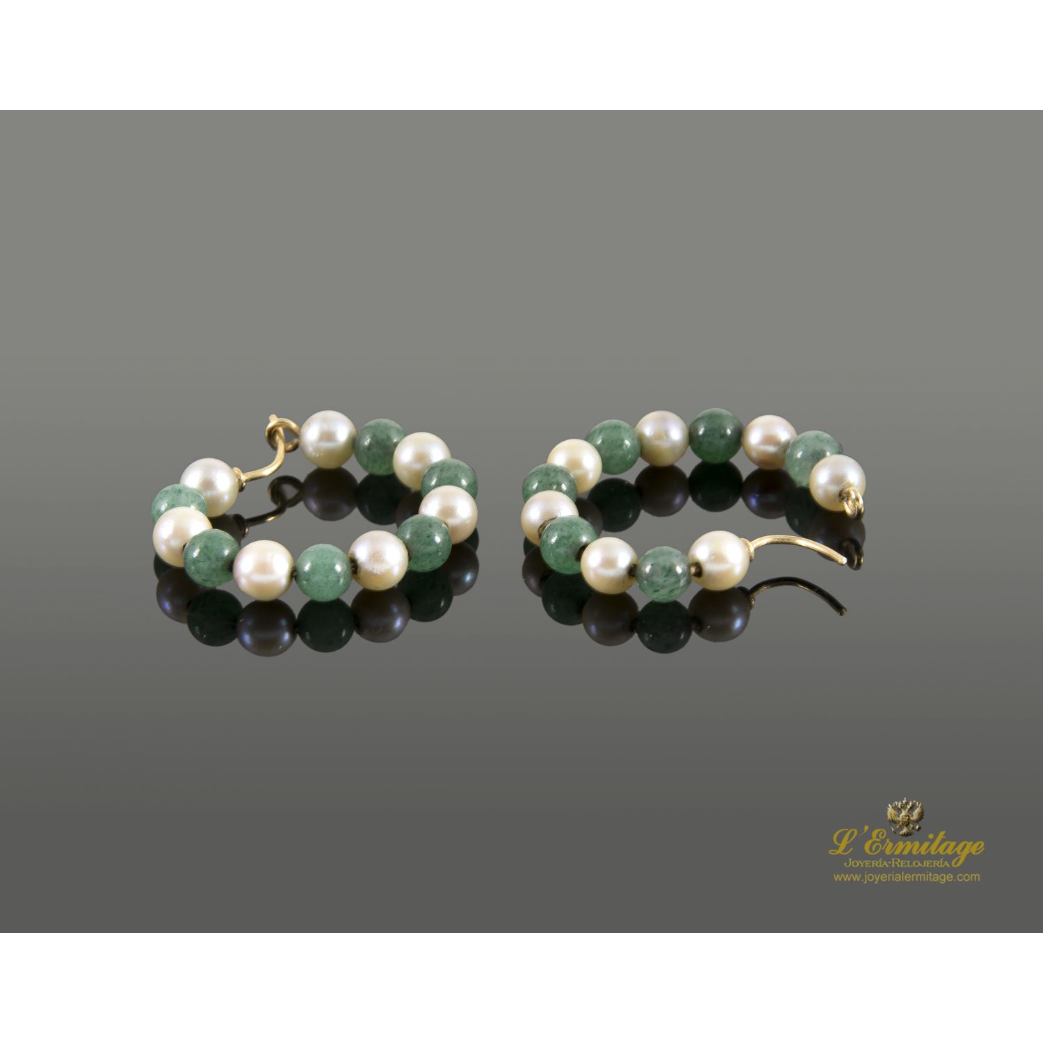 Argollas oro amarillo esmeraldas y perlas.