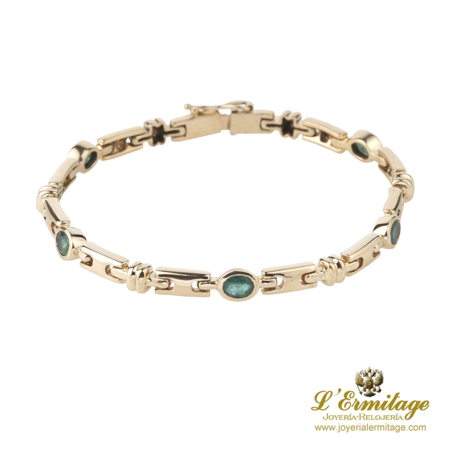 Pulsera en oro amarillo y esmeraldas.