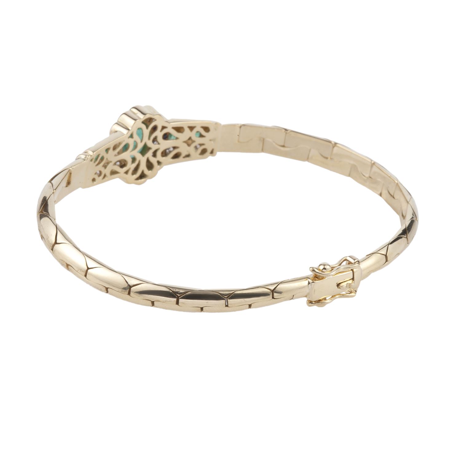 Pulsera en oro amarillo con esmerladas y brillantes.