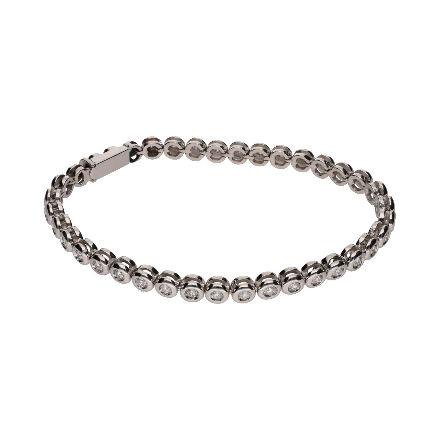 Pulsera riviere en oro blanco con brillantes en chatón.