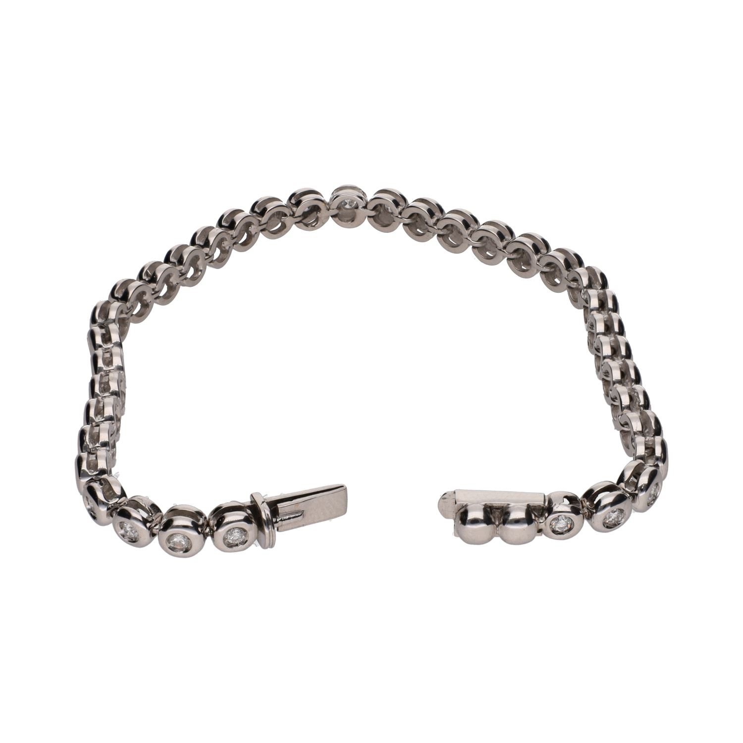 Pulsera riviere en oro blanco con brillantes en chatón.