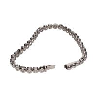 Pulsera riviere en oro blanco con brillantes en chatón.