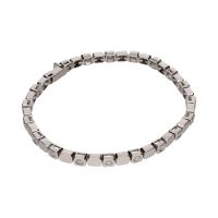 Pulsera tipo riviere en oro blanco con brillantes en chatón.