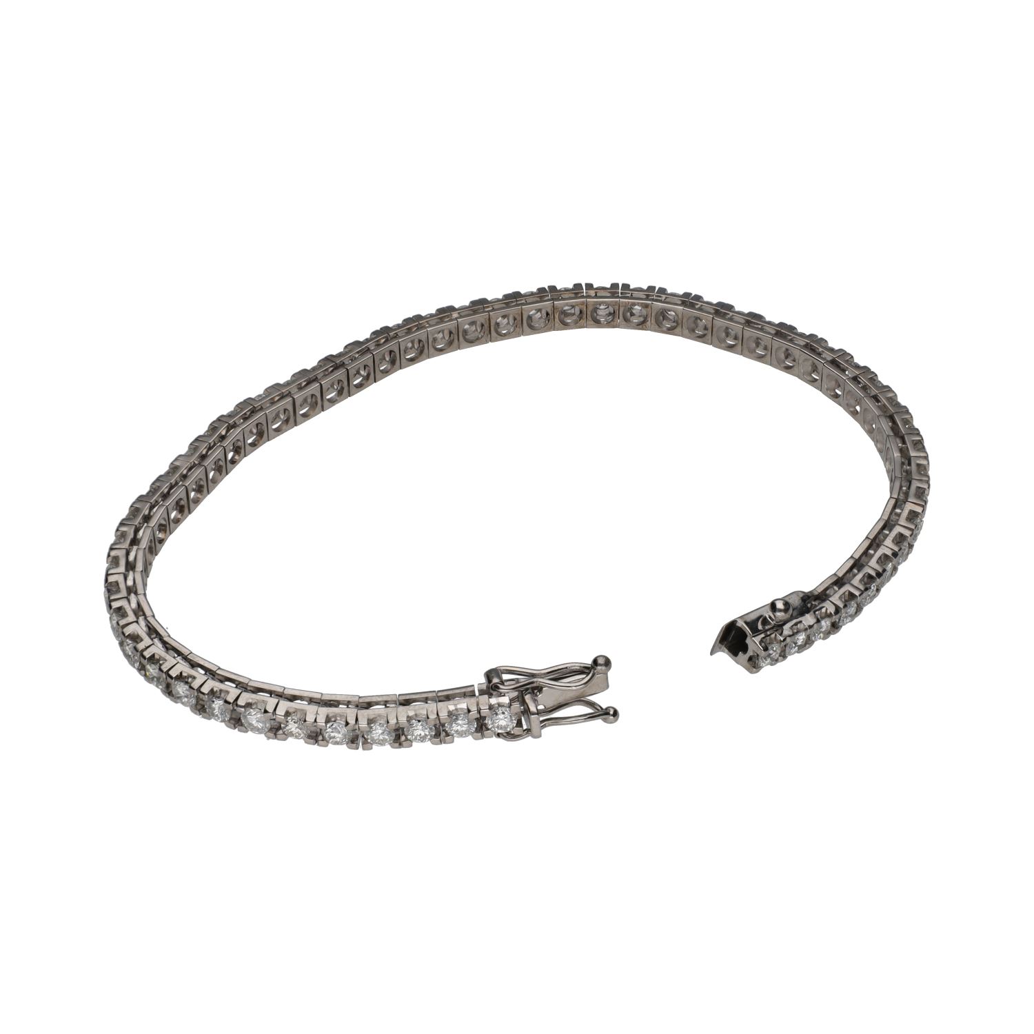 Pulsera riviere en oro blanco con brillantes.