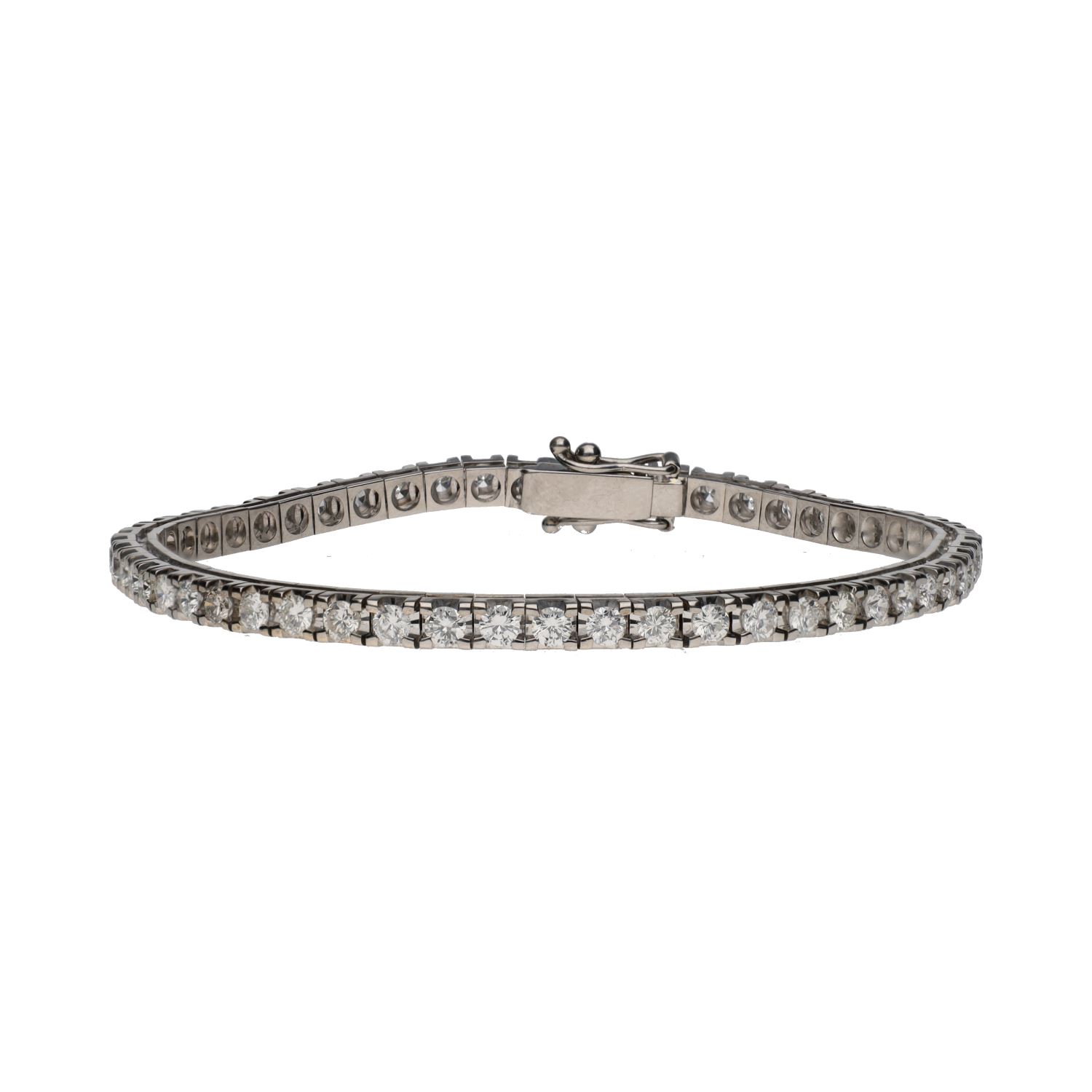 Pulsera riviere en oro blanco con brillantes.