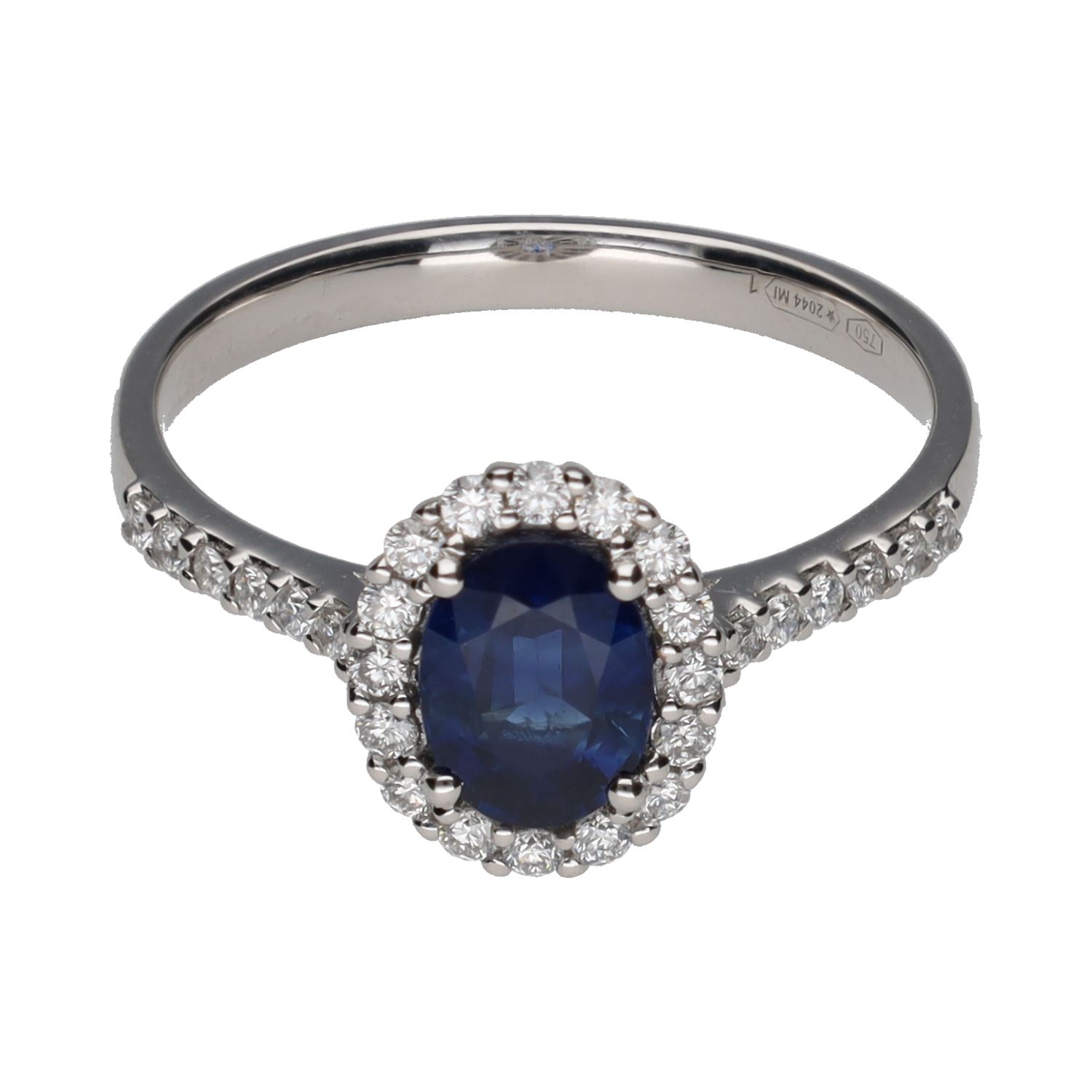 Sortija en oro blanco con zafiro central y brillantes en orla y brazos. Talla 15.