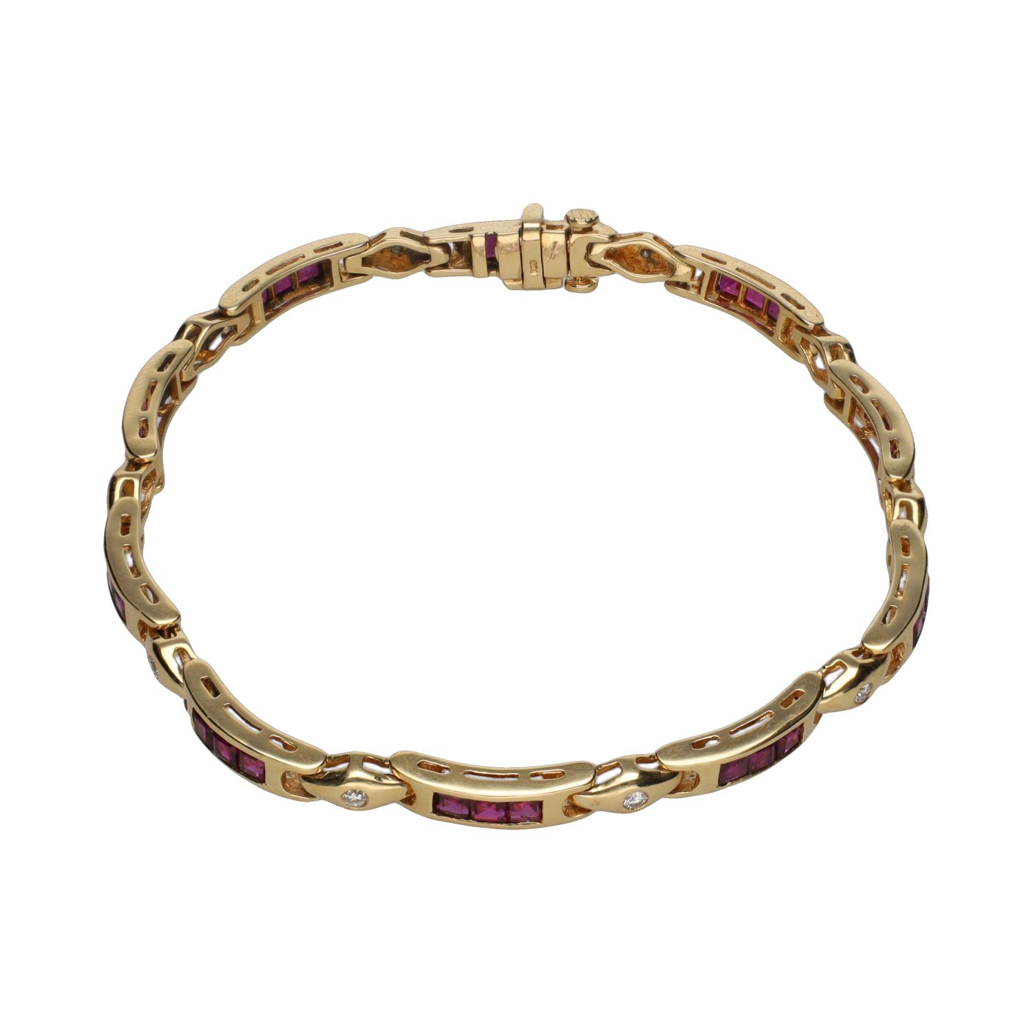 Pulsera en oro amarillo con rubíes y brillantes.