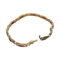 Pulsera en oro amarillo con rubíes y brillantes.