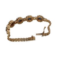 Pulsera en oro amarillo de 14k con zafiros y brillantes.