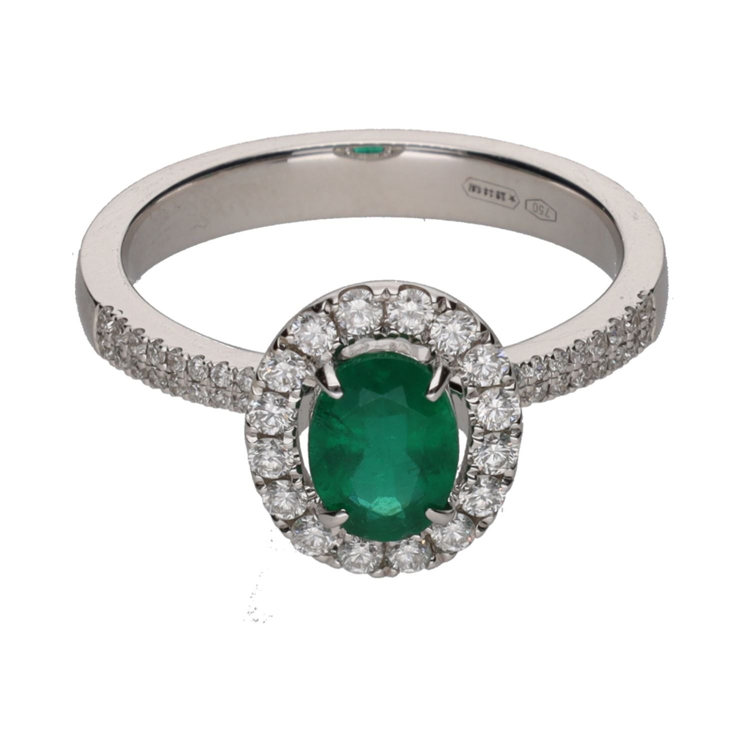 Sortija en oro blanco con esmeralda y orla de brillantes. Talla 14.