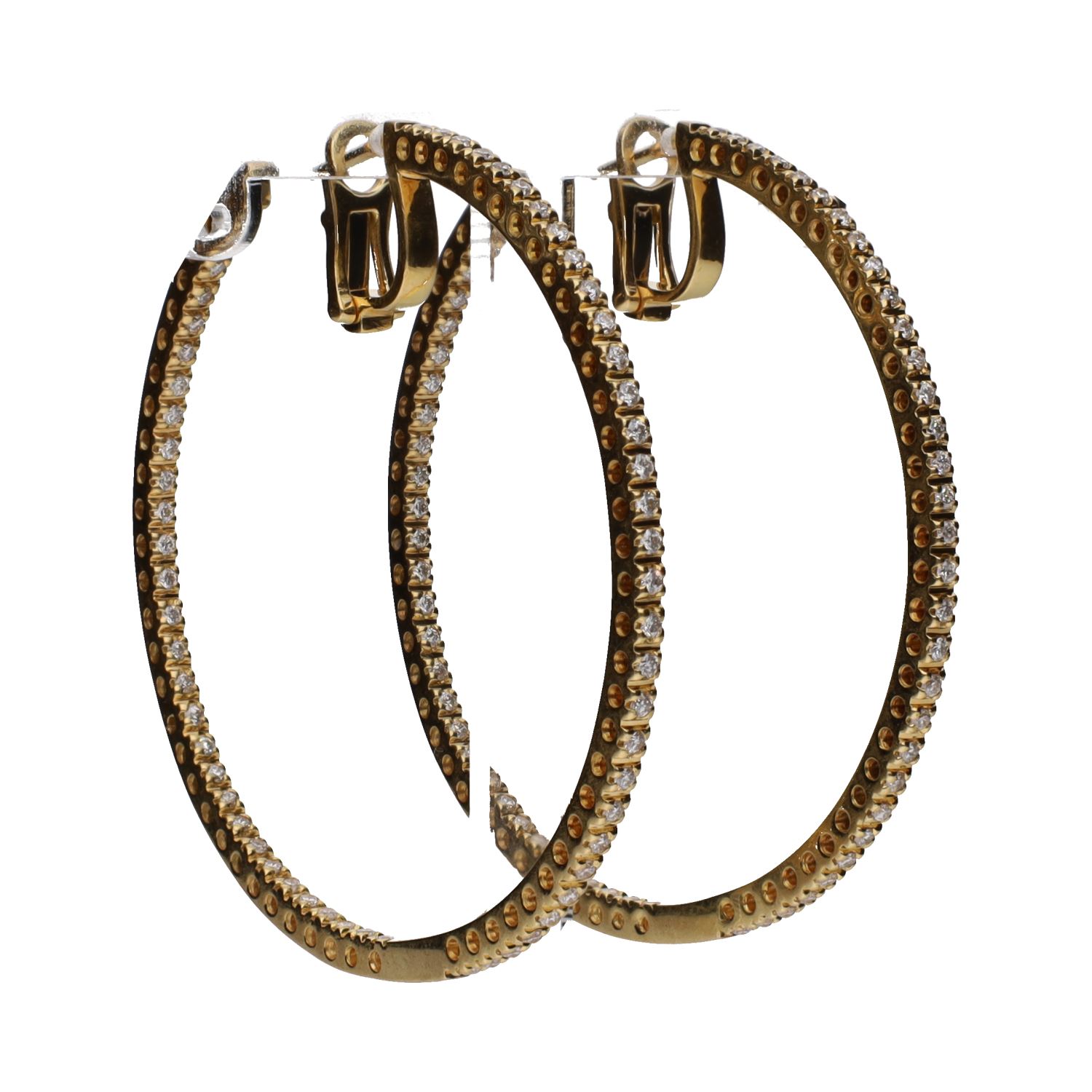 Pendientes argollas en oro amarillo con brillantes.