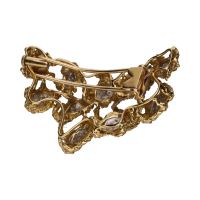 Broche en oro amarillo con cuajados de brillantes.