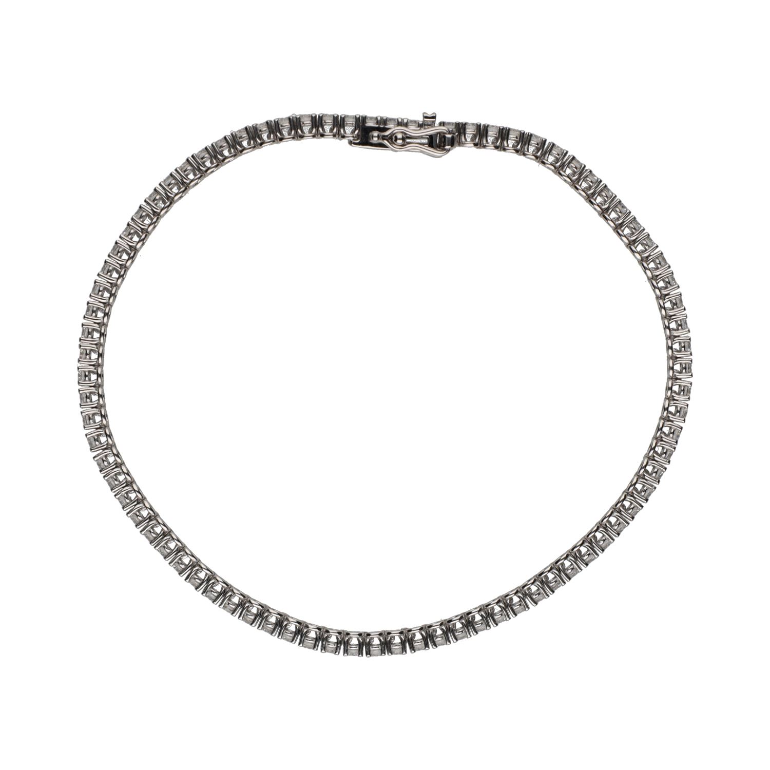 Pulsera riviere en oro blanco con brillantes.