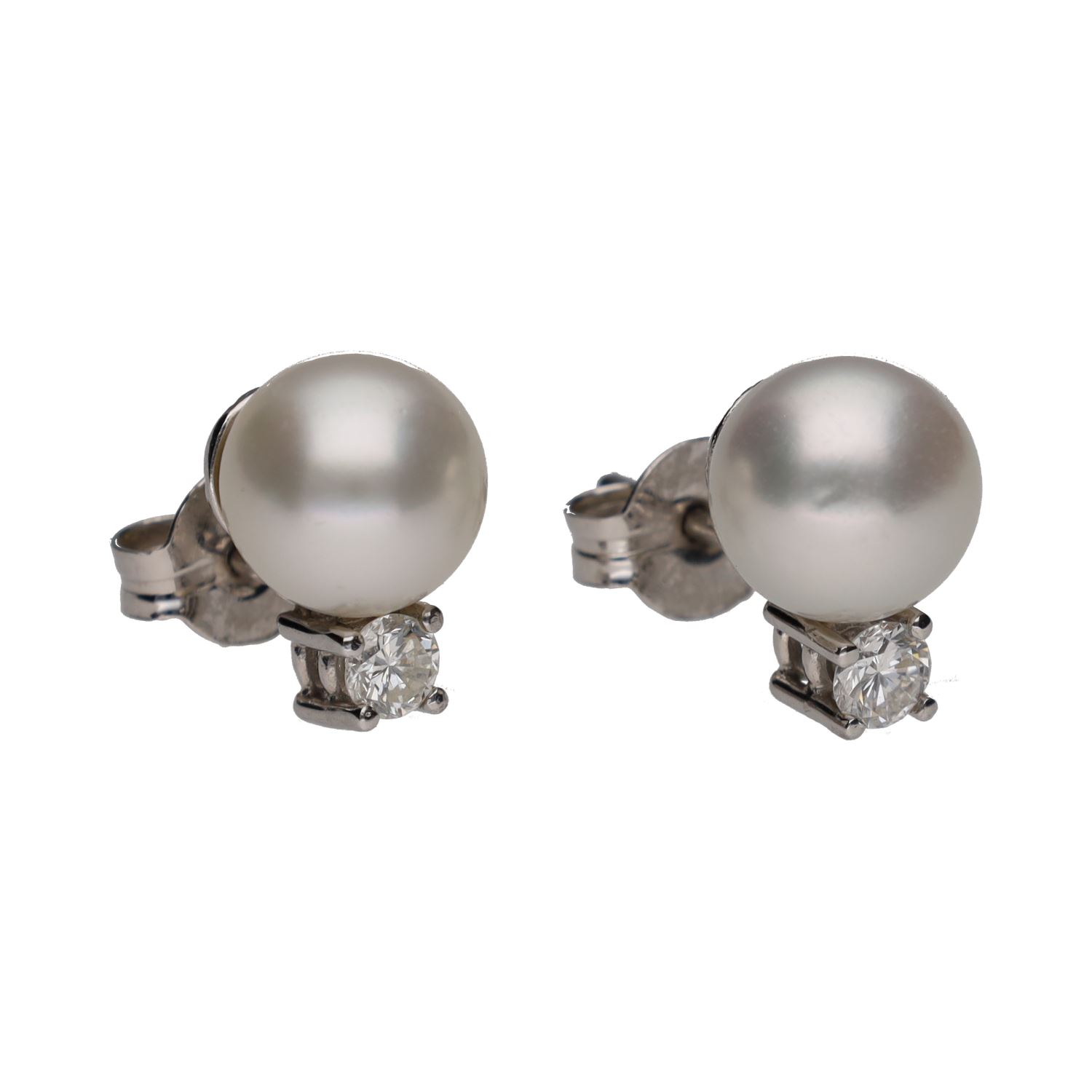 Pendientes tu y yo realizados en oro blanco con perlas y brillantes.