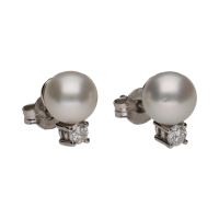 Pendientes tu y yo realizados en oro blanco con perlas y brillantes.