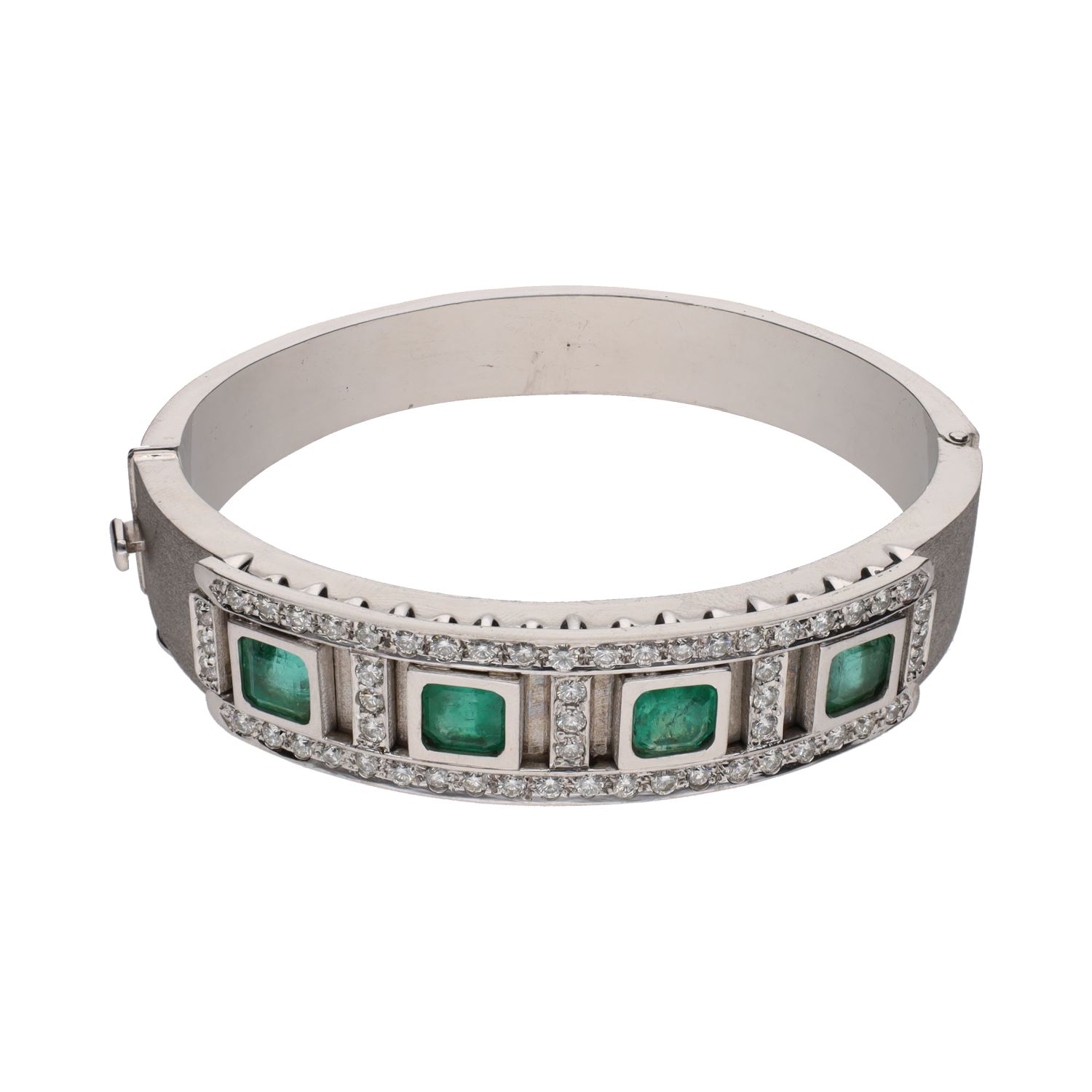Pulsera rígida en oro blanco con esmeraldas y brillantes.