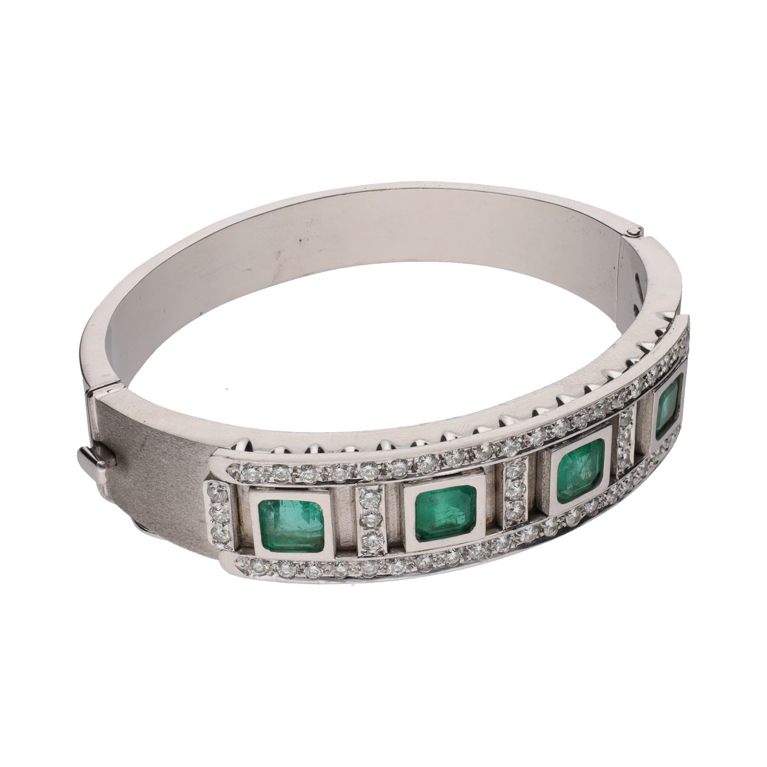Pulsera rígida en oro blanco con esmeraldas y brillantes.