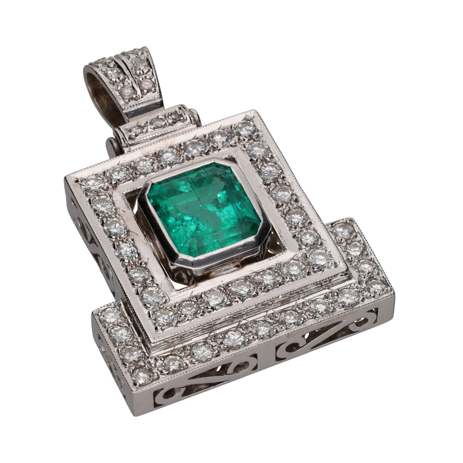 Colgante en oro blanco con esmeralda y brillantes.