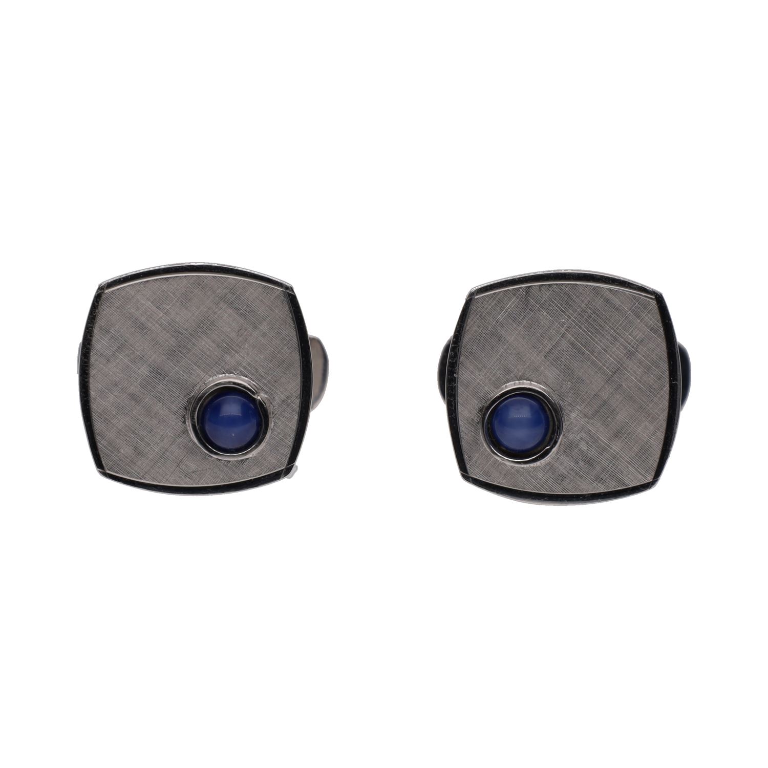 Gemelos en oro blanco con zafiros estrella.