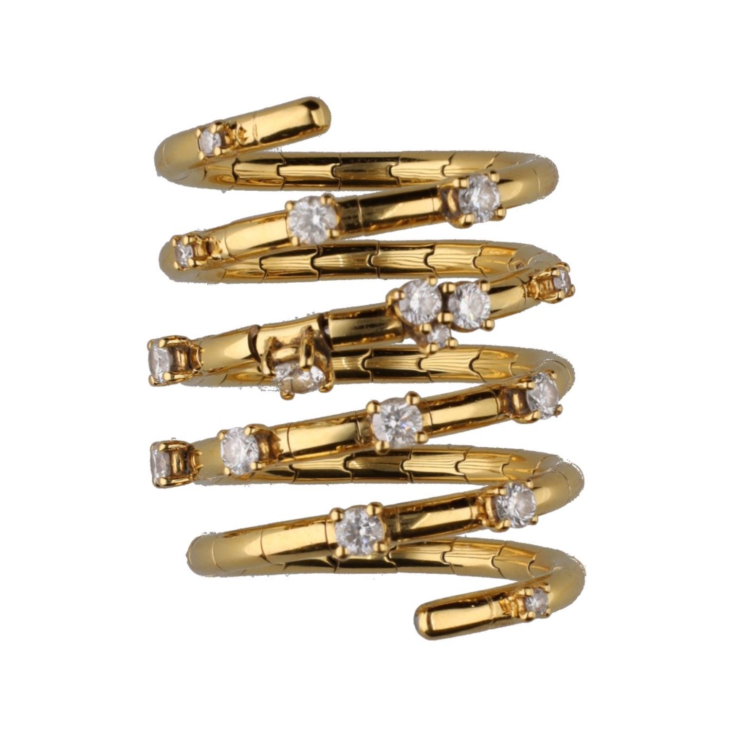 Sortija tipo muelle en oro amarillo con brillantes.