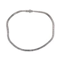 Pulsera riviere en oro blanco con brillantes.