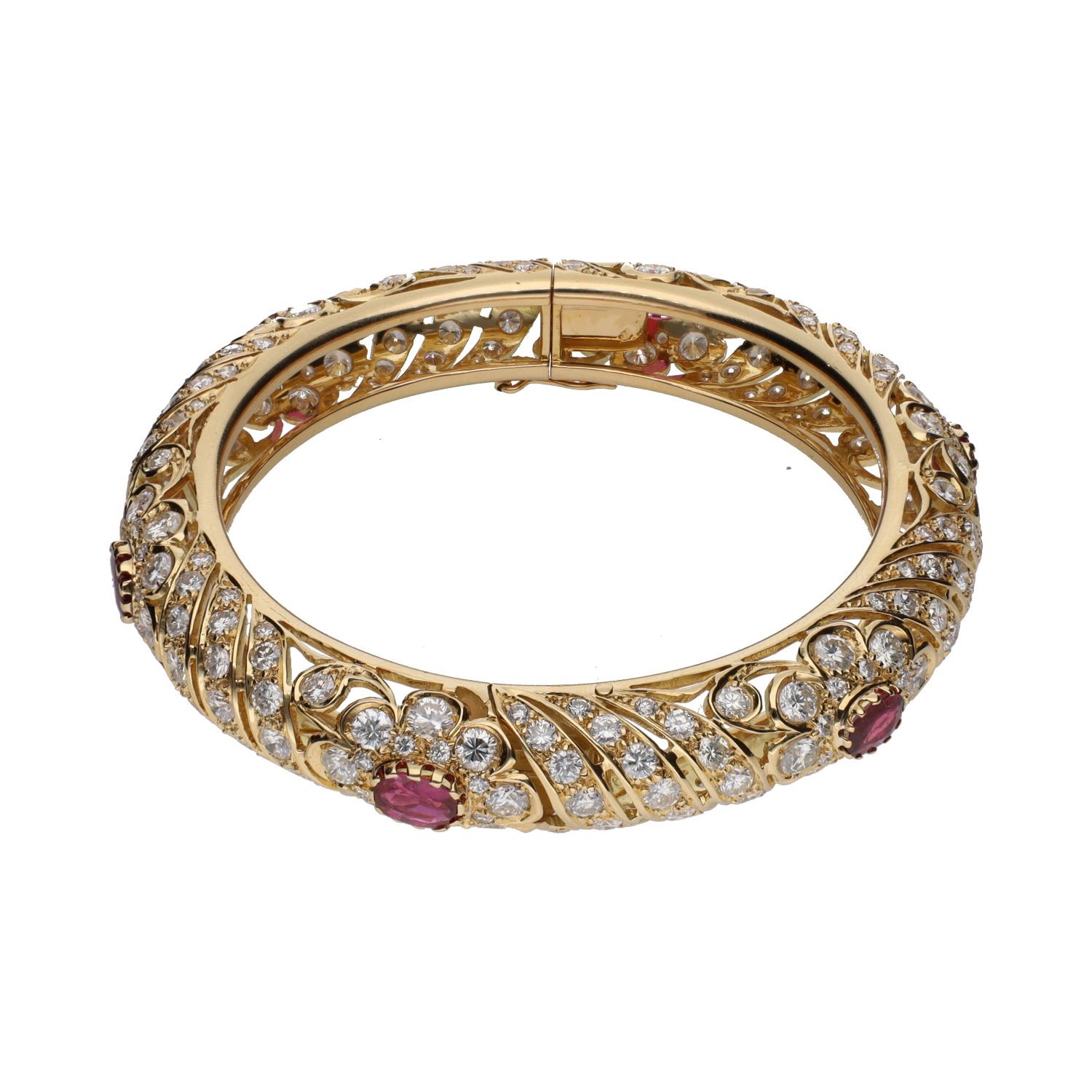 Pulsera rígida en oro amarillo con rubíes y brillantes.