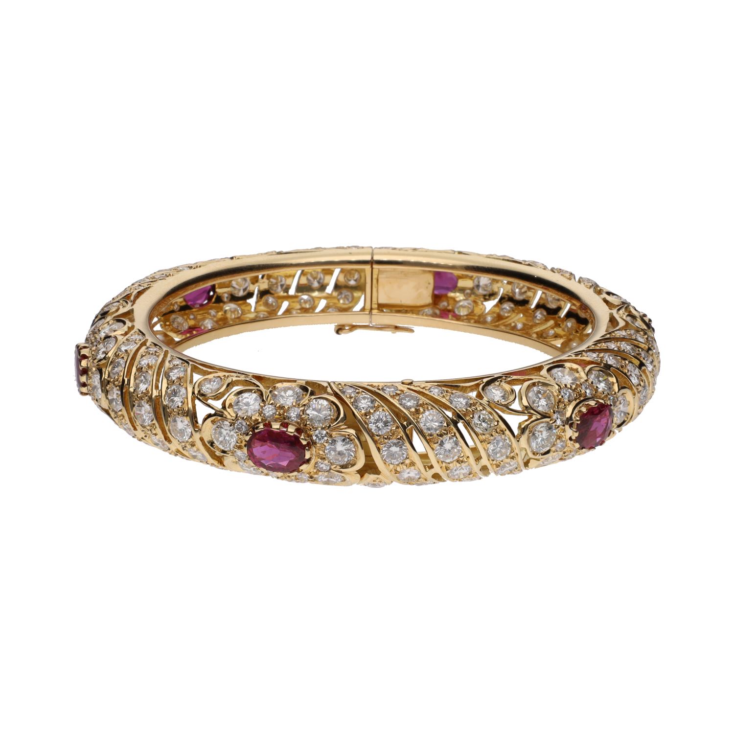 Pulsera rígida en oro amarillo con rubíes y brillantes.