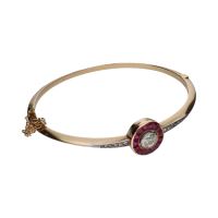 Pulsera rígida antigua en oro amarillo con diamantes y rubíes.