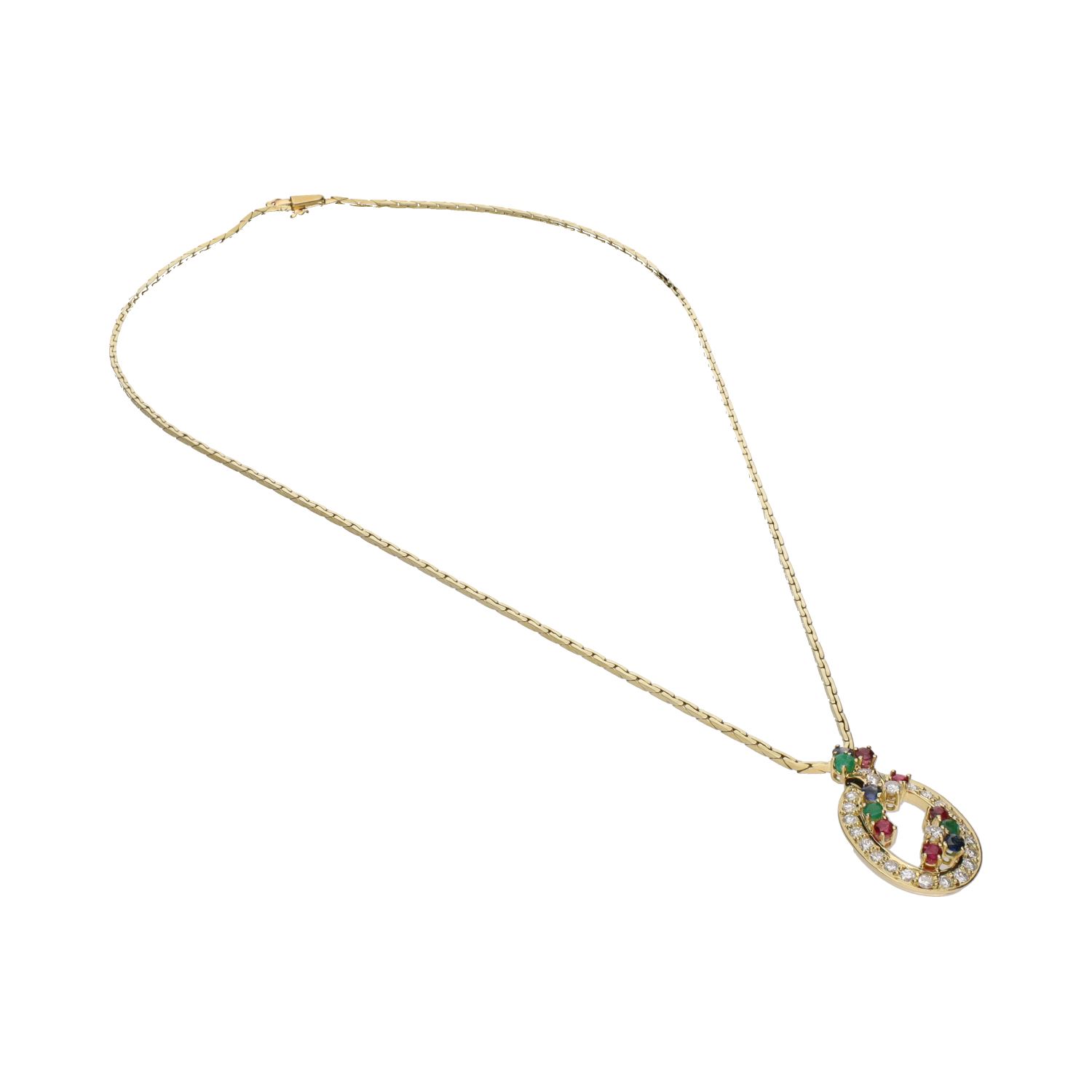 Collar en oro amarillo con esmeraldas, rubíes, zafiros y brillantes.