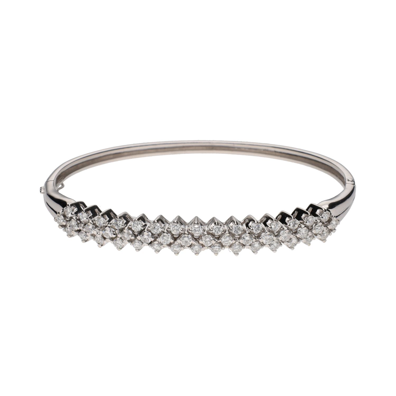 Pulsera rígida en oro blanco con brillantes.