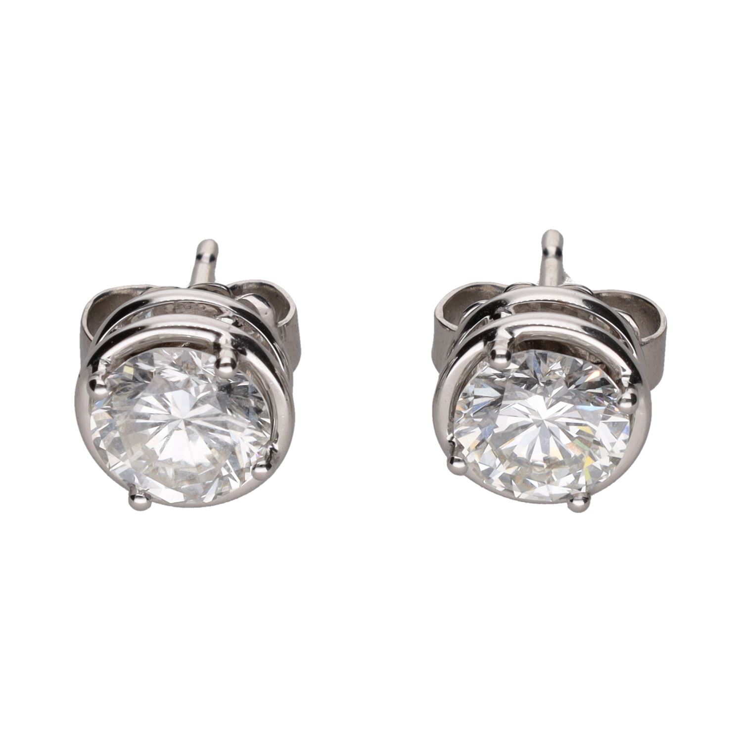 Pendientes dormilonas en oro blanco con brillantes.