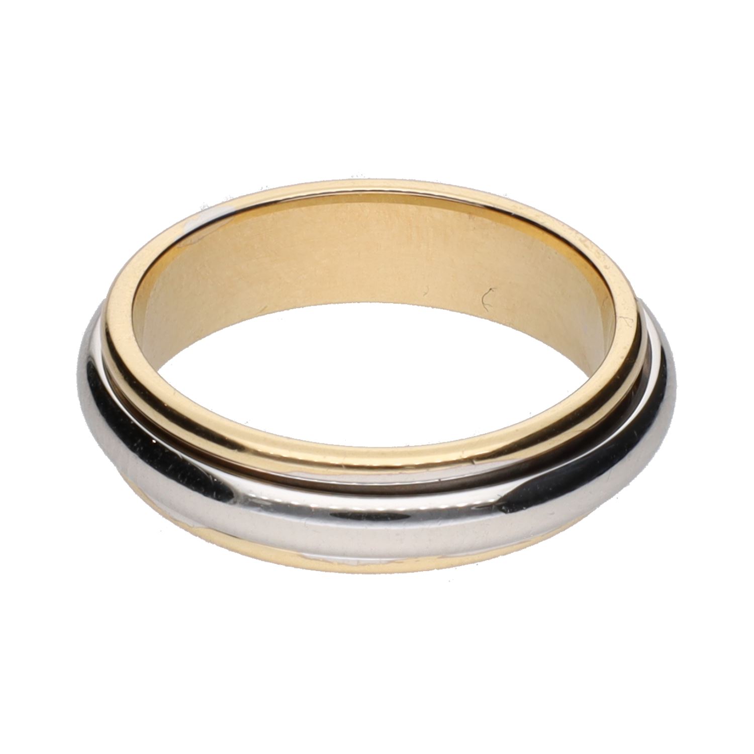 Sortija en oro amarillo con aro giratorio en oro blanco. Talla 13.