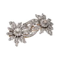 Broche doble clip en oro amarillo y oro blanco con diamantes.