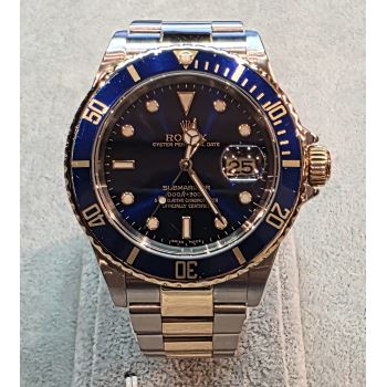 ROLEX<BR>SUBMARINER ACERO Y ORO AZUL 40MM. · ref.: 16613T