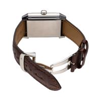 Reverso grande date reserva de marcha acero cuerda manual.  